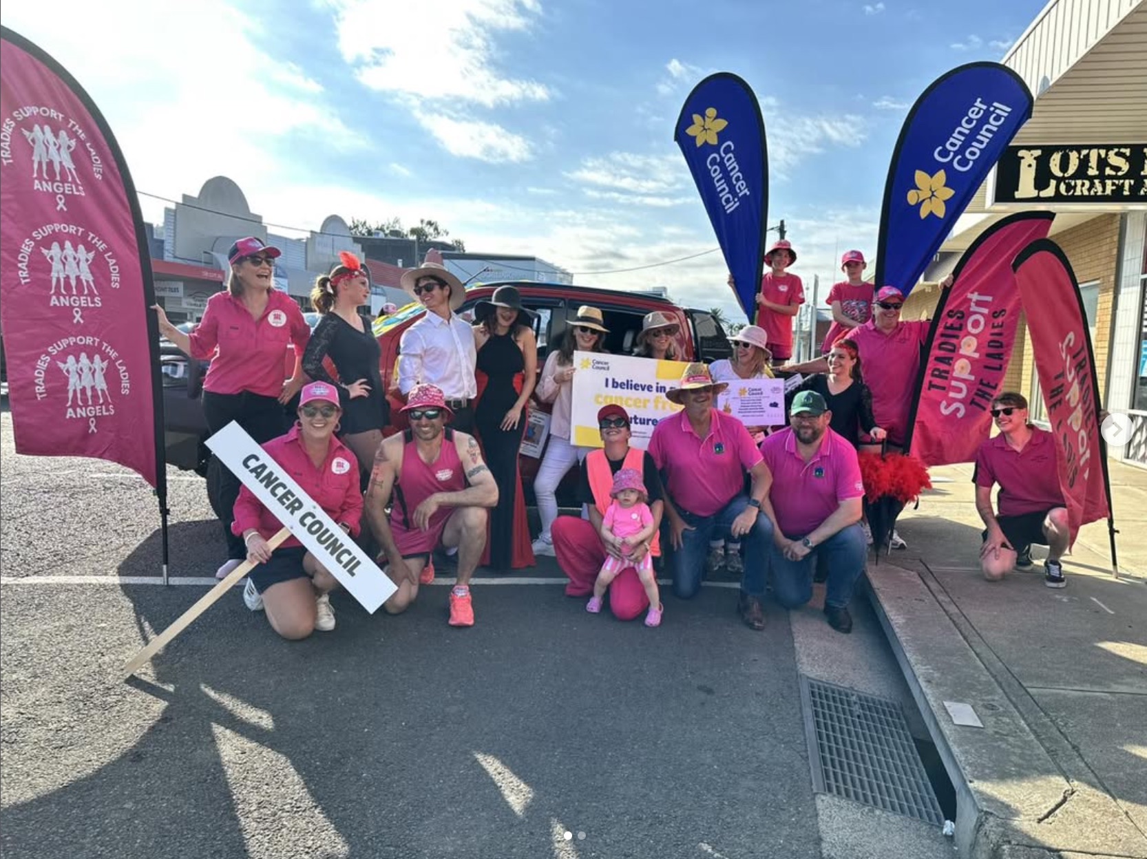 Large group with Cancer Council banners at an outdoor event