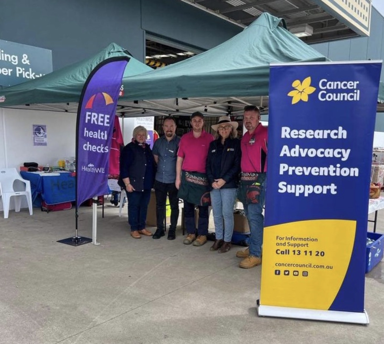 Supporters at a Cancer Council health check booth